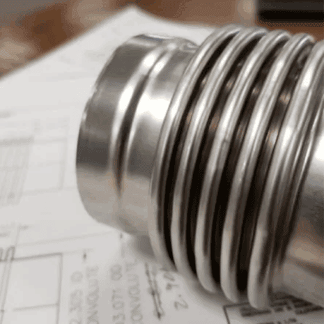 Precision-machined metal piston for industrial applications.