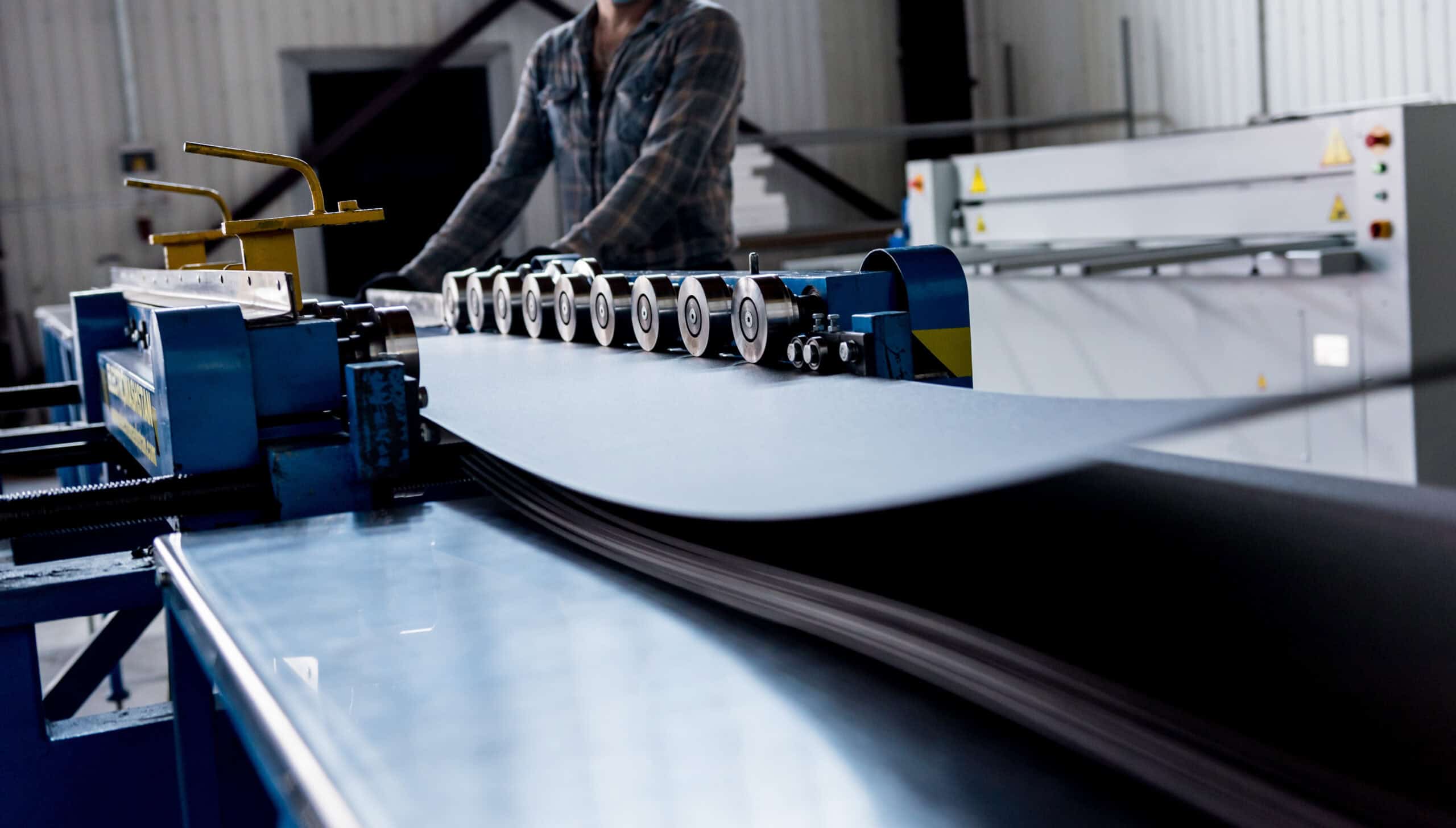 High-speed manufacturing machinery for industrial rubber and plastic products at Kelco Industries.