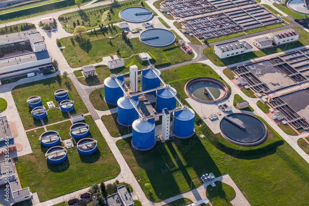 Industrial wastewater treatment plant with clarifiers and tanks at Kelco Industries.