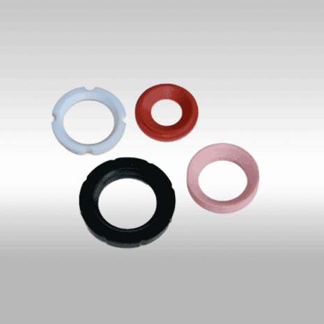 White and red plastic washers for industrial sealing applications.