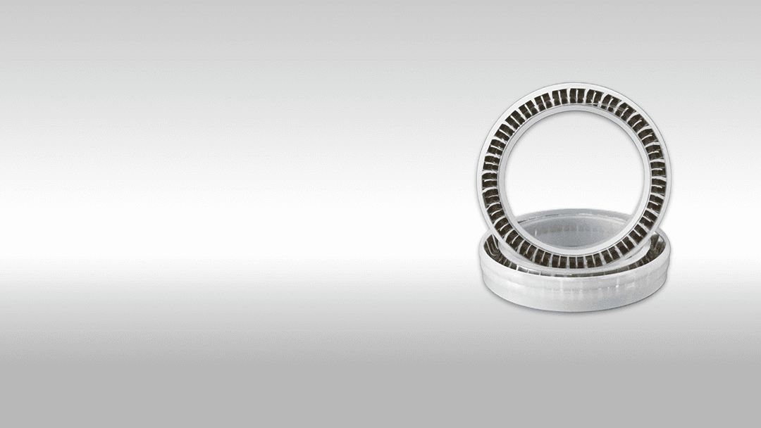 Miniature ball bearings stacked together for industrial machinery.