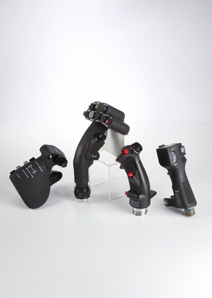 Control sticks and joysticks used in industrial or flight simulation applications.