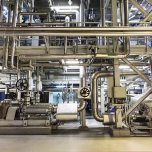 High-capacity industrial piping and machinery at Kelco Industries manufacturing plant.