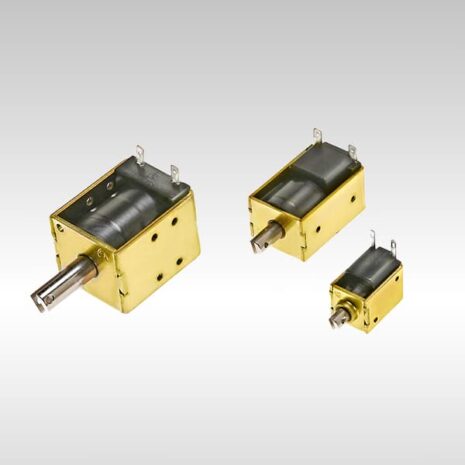 High-precision industrial stepper motors with gold and black finish for automation applications.