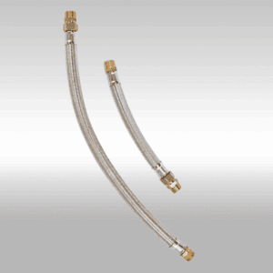 Flexible metal hoses with brass fittings for industrial fluid transfer applications.