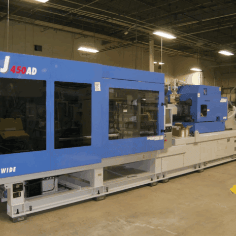 injection molded components.jpg High-capacity injection molding machine for industrial manufacturing by Kelco Industries.