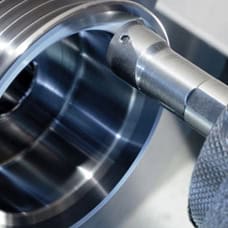 High-precision industrial machining part with CNC tools, showcasing advanced manufacturing techniques.