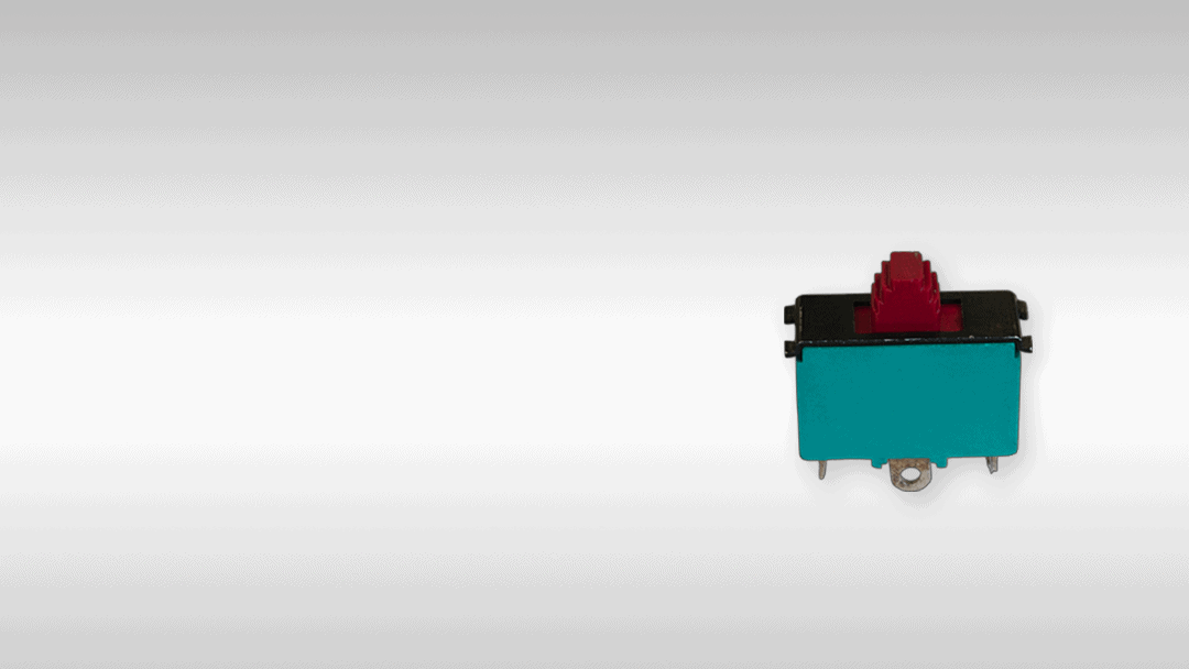 Miniature rocker switch for electrical control panels, durable industrial switch component.