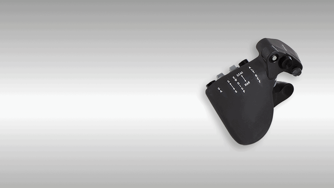 Precision ergonomic joystick controller for industrial machinery by Kelco Industries.